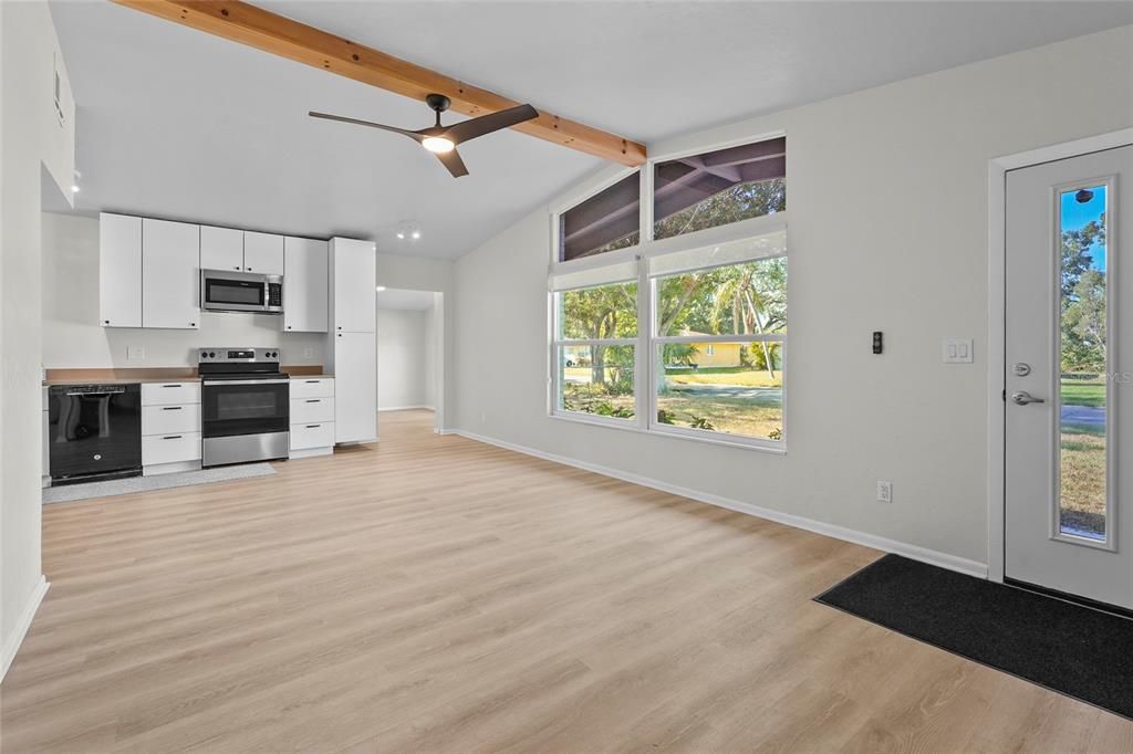 Empty room, Interior, Kitchen, Recessed Lighting, Stainless Steel Appliances, Wooden Beams, Wood Texture Flooring