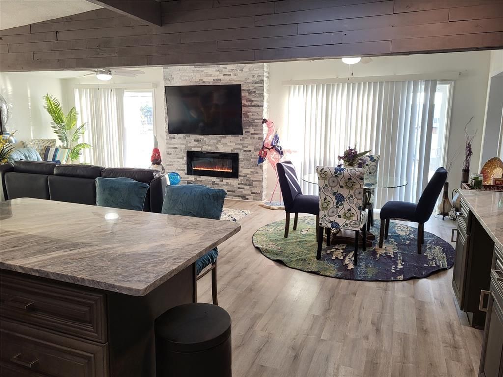 Dining room, Fireplace, Interior, Living room, Stone Walls, Wood Texture Flooring