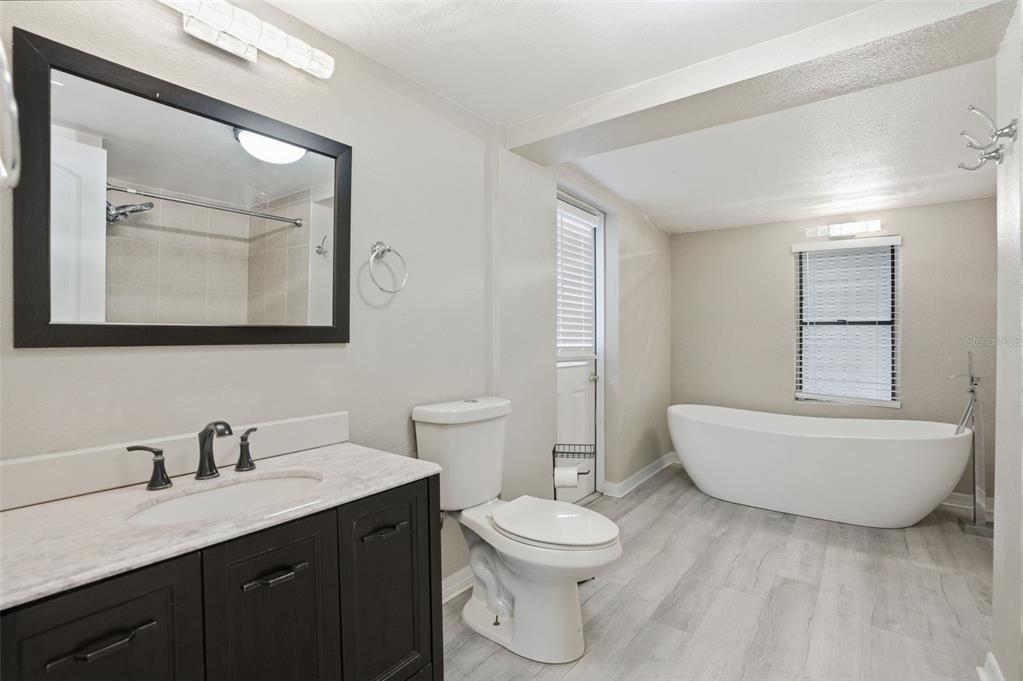 Bathroom, Dual Sink Vanities, Free Standing Baths, Interior, Wood Texture Flooring