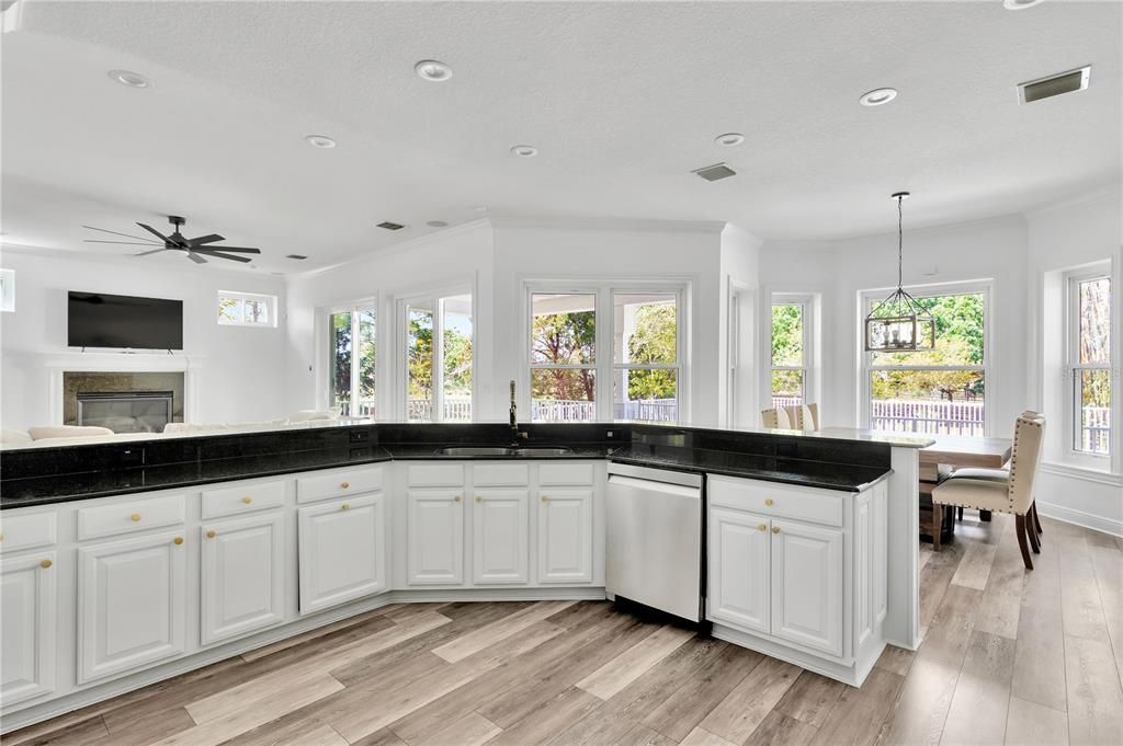 Dining room, Fireplace, Interior, Kitchen, Pendant Lights, Recessed Lighting, Wood Texture Flooring
