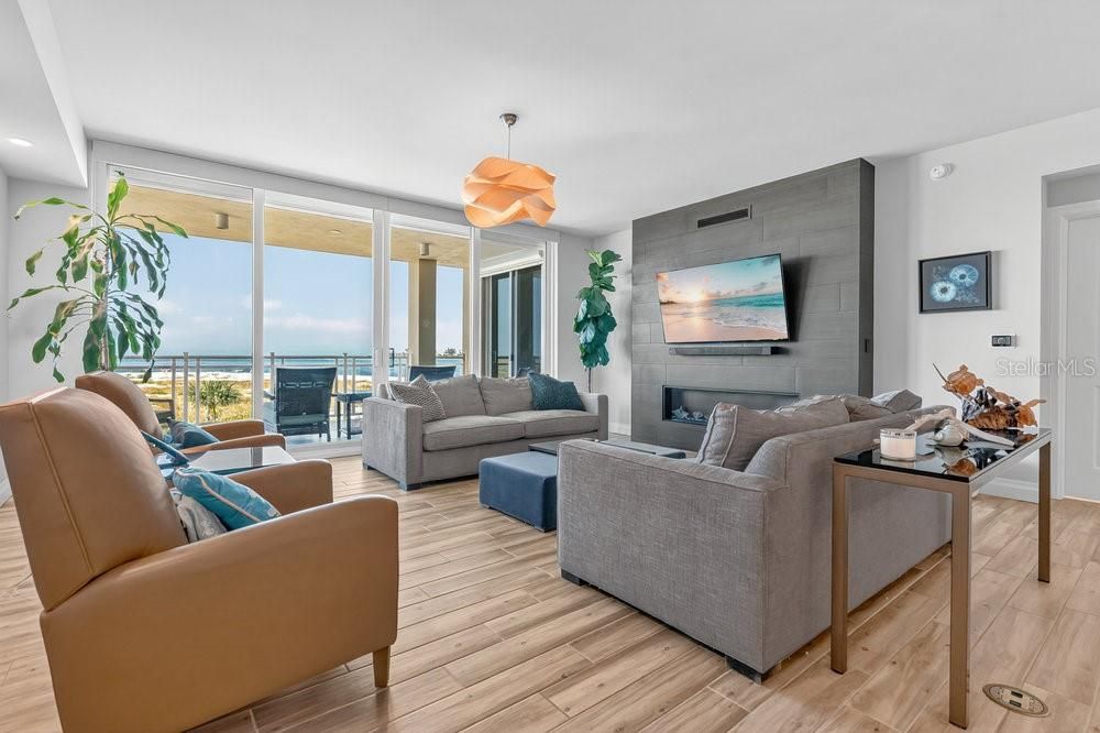 Fireplace, Interior, Living room, Pendant Lights, Recessed Lighting, Water, Wood Texture Flooring