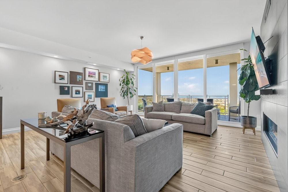 Fireplace, Interior, Living room, Pendant Lights, Recessed Lighting, Water, Wood Texture Flooring