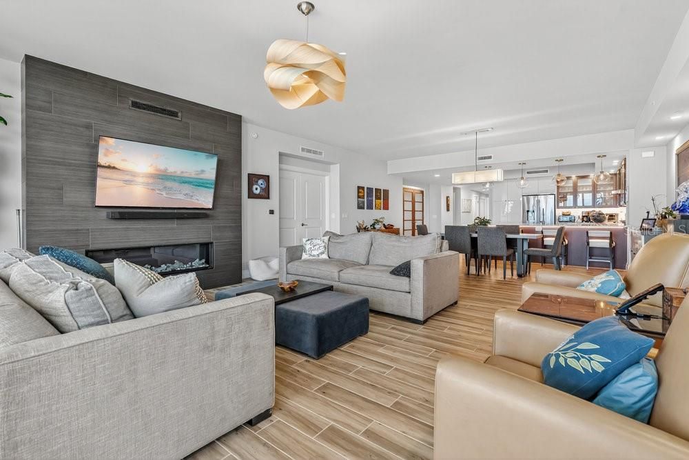 Dining room, Fireplace, Interior, Living room, Pendant Lights, Recessed Lighting, Wood Texture Flooring