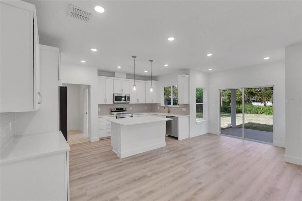 Interior, Kitchen, Pendant Lights, Recessed Lighting, Stainless Steel Appliances, Wood Texture Flooring