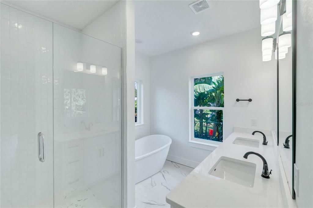 Bathroom, Free Standing Baths, Glass Shower, Interior, Marble, Marble Walls, Recessed Lighting
