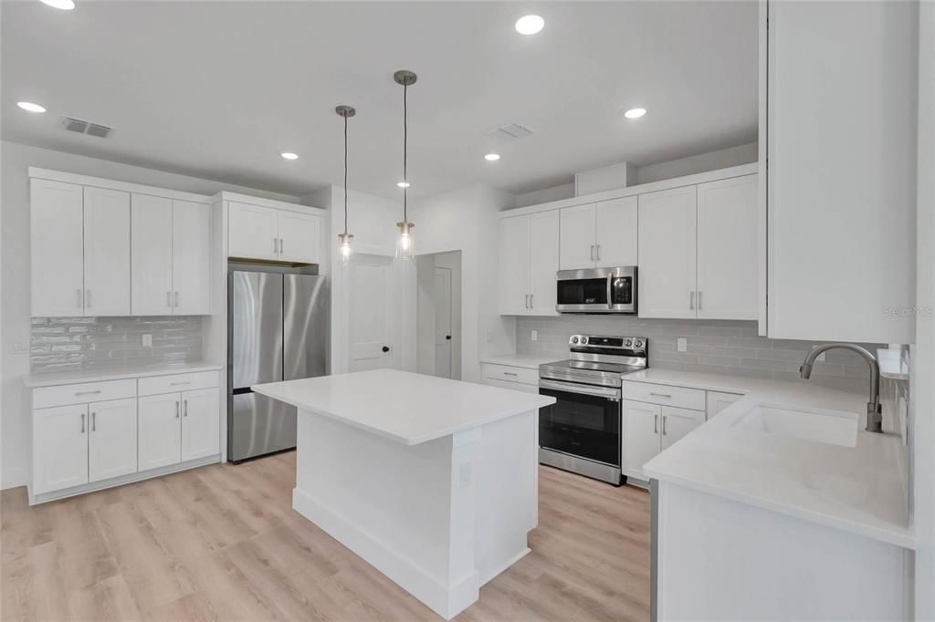 Interior, Kitchen, Pendant Lights, Recessed Lighting, Stainless Steel Appliances, Wood Texture Flooring