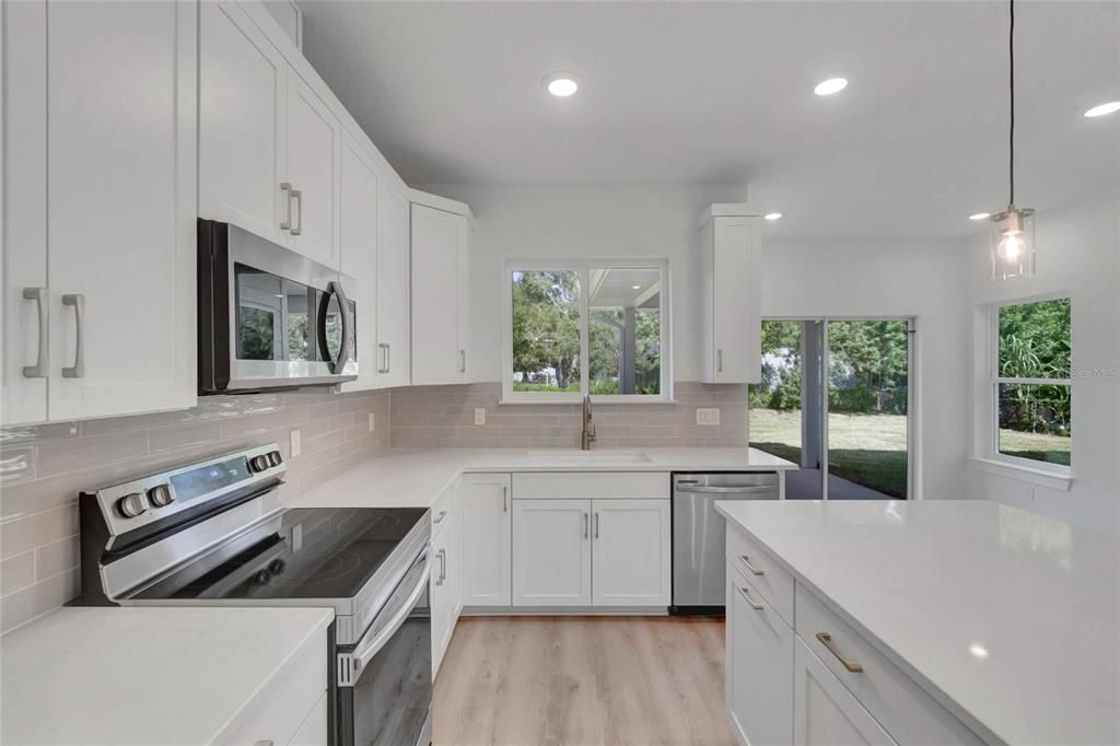Interior, Kitchen, Pendant Lights, Recessed Lighting, Stainless Steel Appliances, Wood Texture Flooring