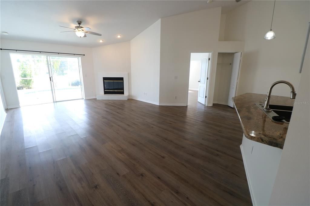 Empty room, Fireplace, Interior, Pendant Lights, Recessed Lighting, Wood Texture Flooring