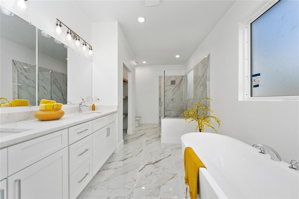 Bathroom, Dual Sink Vanities, Free Standing Baths, Glass Shower, Interior, Marble, Marble Walls, Recessed Lighting