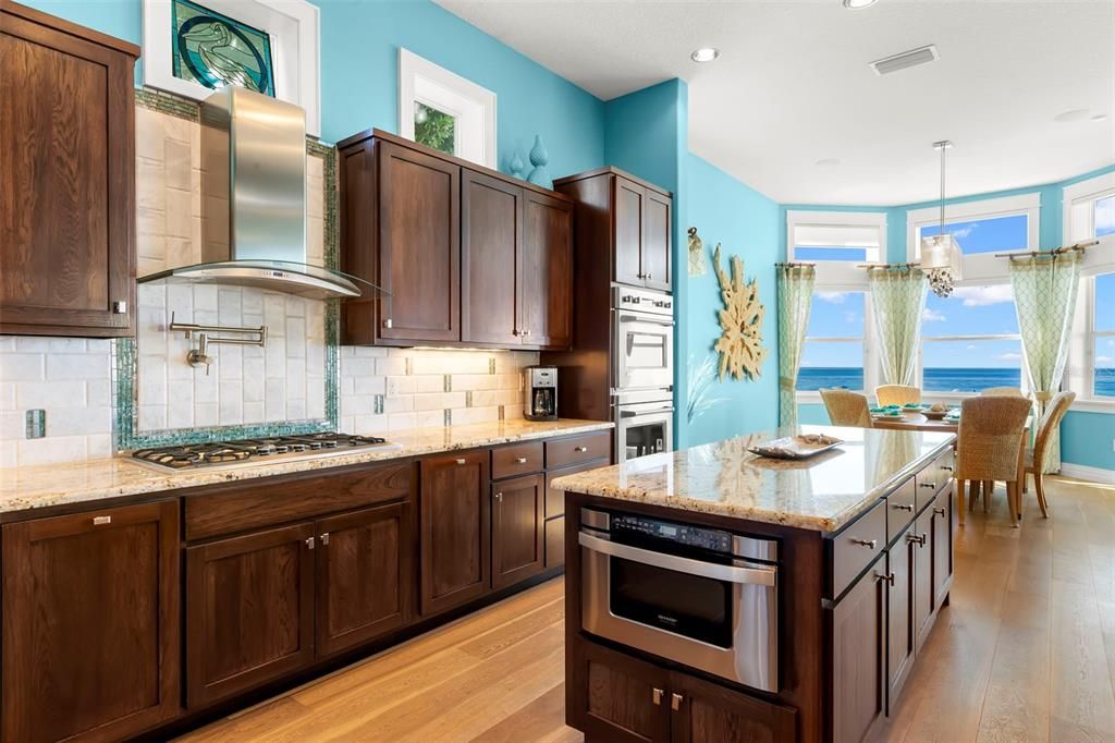 Dining room, Interior, Kitchen, Pendant Lights, Recessed Lighting, Stainless Steel Appliances, Water, Wood Texture Flooring