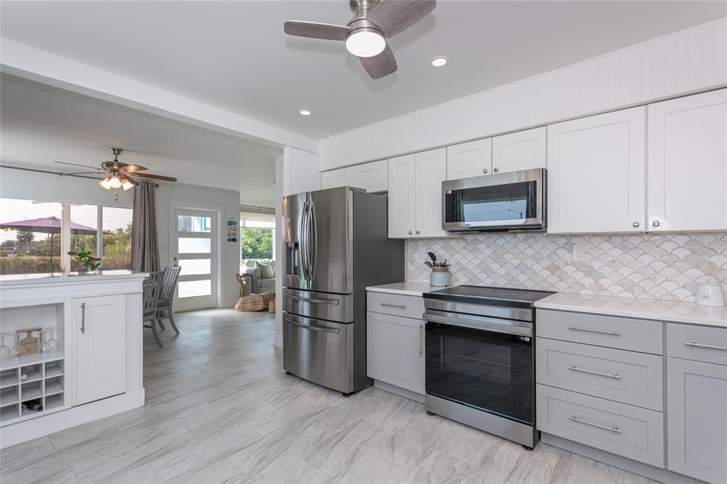 Interior, Kitchen, Marble, Recessed Lighting, Stainless Steel Appliances, Wood Texture Flooring