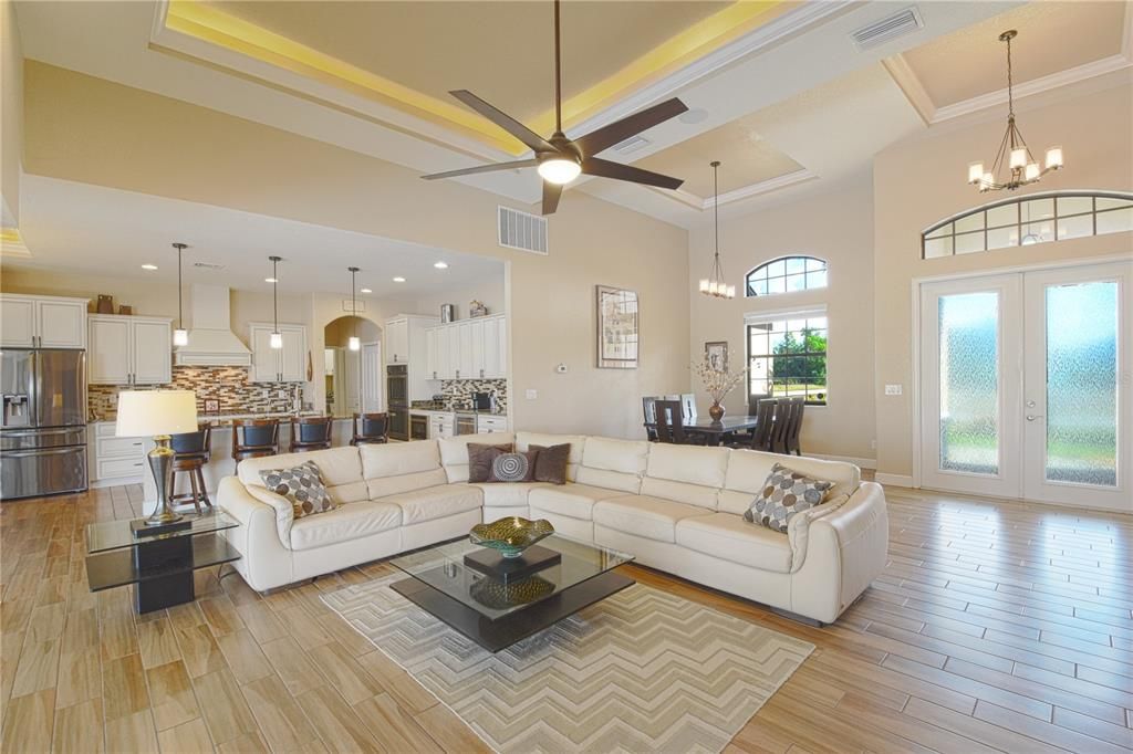 Chandelier, Dining room, Interior, Kitchen, Living room, Pendant Lights, Recessed Lighting, Stainless Steel Appliances, Wood Texture Flooring