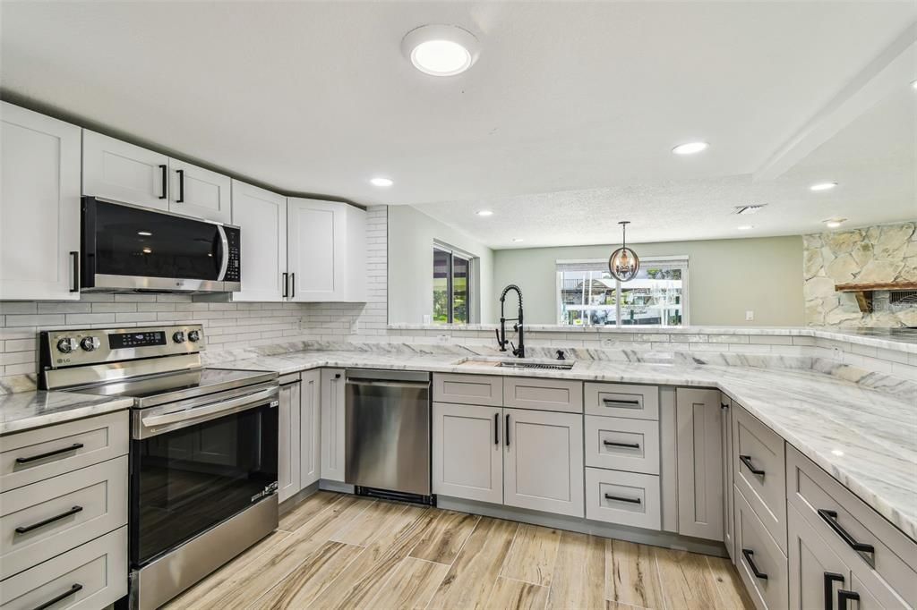Interior, Kitchen, Recessed Lighting, Stainless Steel Appliances, Stone Walls, Wood Texture Flooring