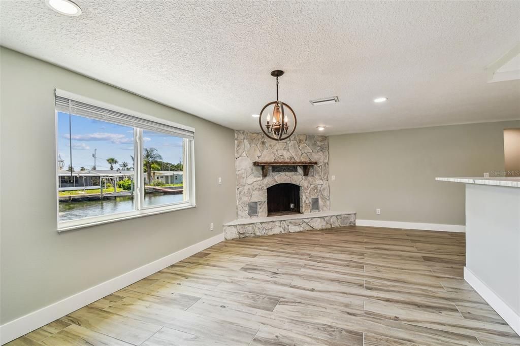 Empty room, Fireplace, Interior, Pendant Lights, Recessed Lighting, Wood Texture Flooring