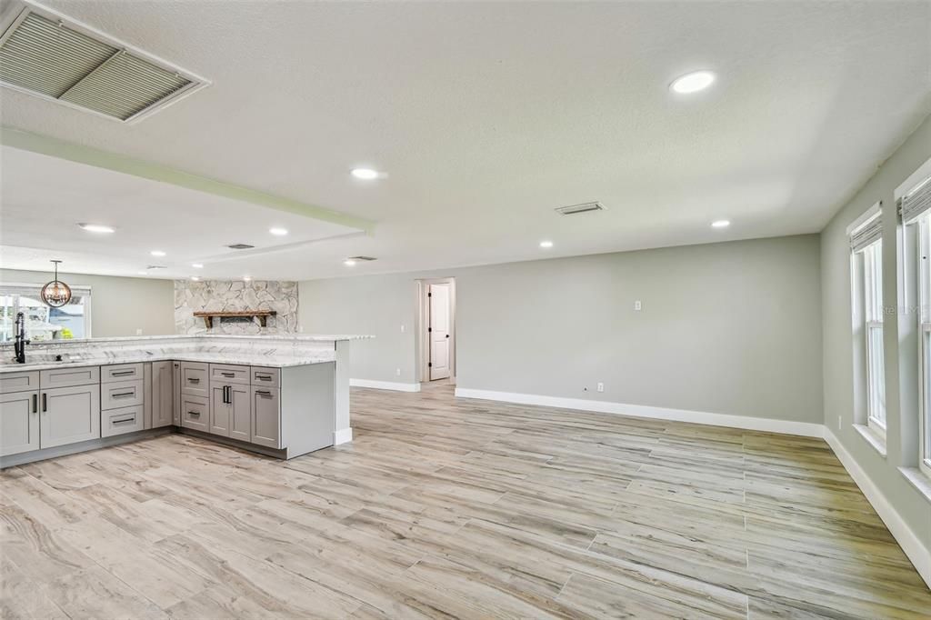 Interior, Kitchen, Marble Walls, Pendant Lights, Recessed Lighting, Wood Texture Flooring