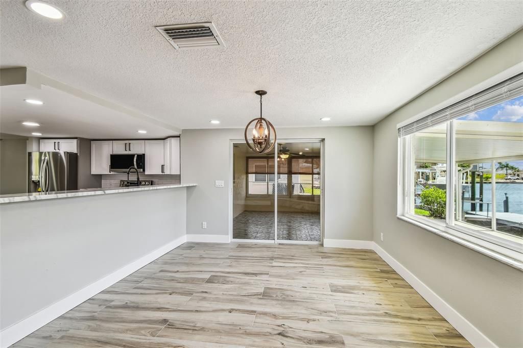 Chandelier, Interior, Kitchen, Pendant Lights, Recessed Lighting, Stainless Steel Appliances, Water, Wood Texture Flooring