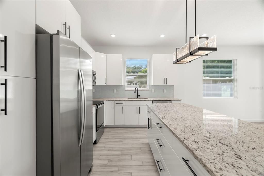 Interior, Kitchen, Pendant Lights, Recessed Lighting, Stainless Steel Appliances, Wood Texture Flooring