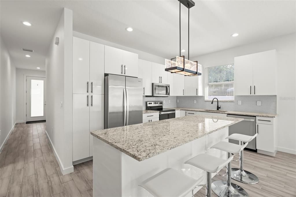 Interior, Kitchen, Pendant Lights, Recessed Lighting, Stainless Steel Appliances, Wood Texture Flooring