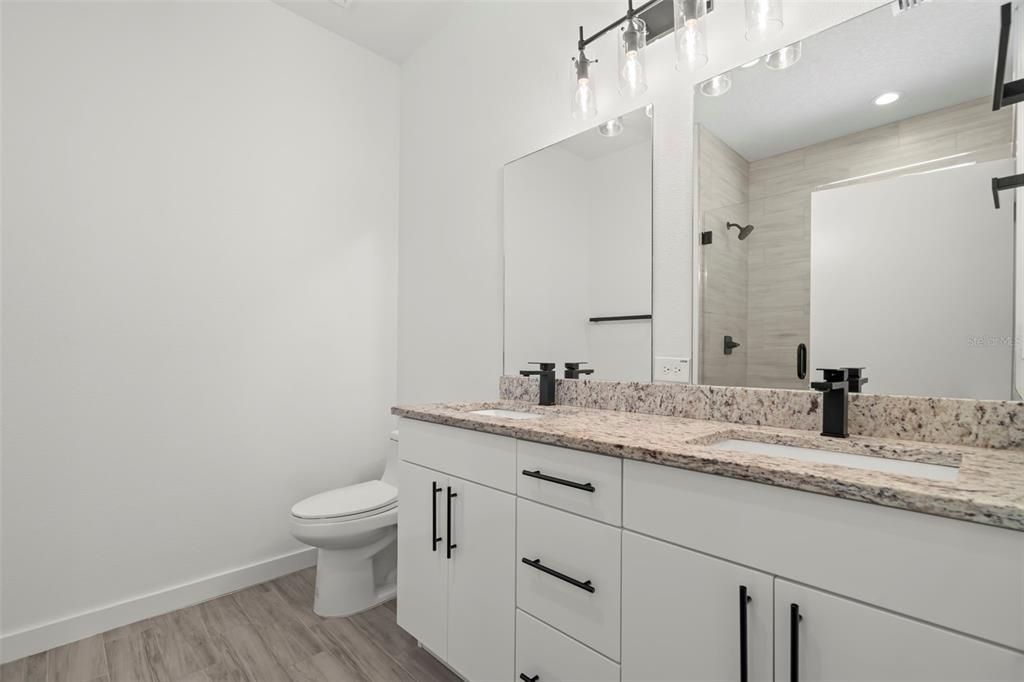 Bathroom, Dual Sink Vanities, Interior, Recessed Lighting, Wood Texture Flooring