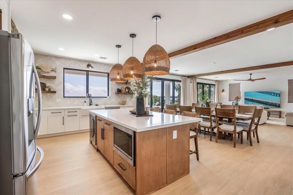 Dining room, Interior, Kitchen, Pendant Lights, Recessed Lighting, Stainless Steel Appliances, Wood Texture Flooring