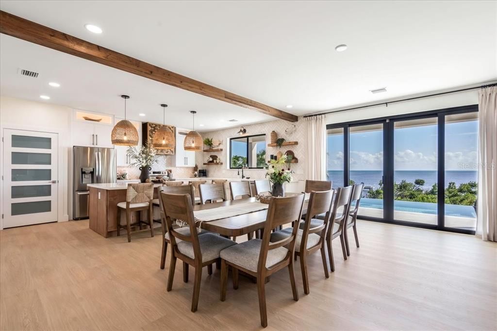 Dining room, Interior, Kitchen, Pendant Lights, Recessed Lighting, Stainless Steel Appliances, Water, Wooden Beams, Wood Texture Flooring
