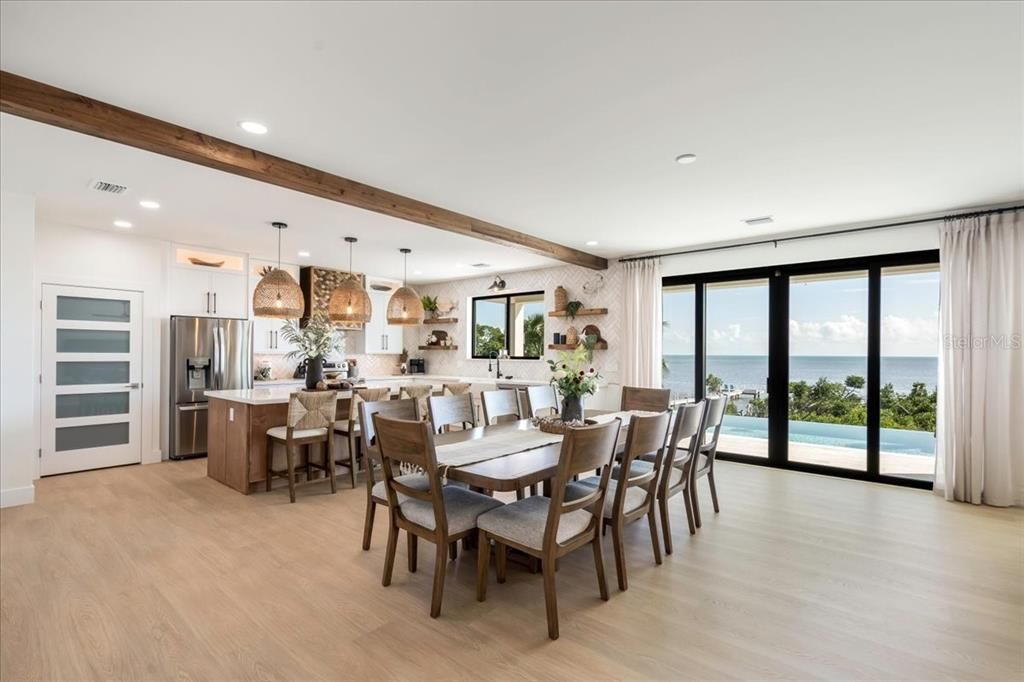 Dining room, Interior, Kitchen, Pendant Lights, Recessed Lighting, Stainless Steel Appliances, Water, Wooden Beams, Wood Texture Flooring