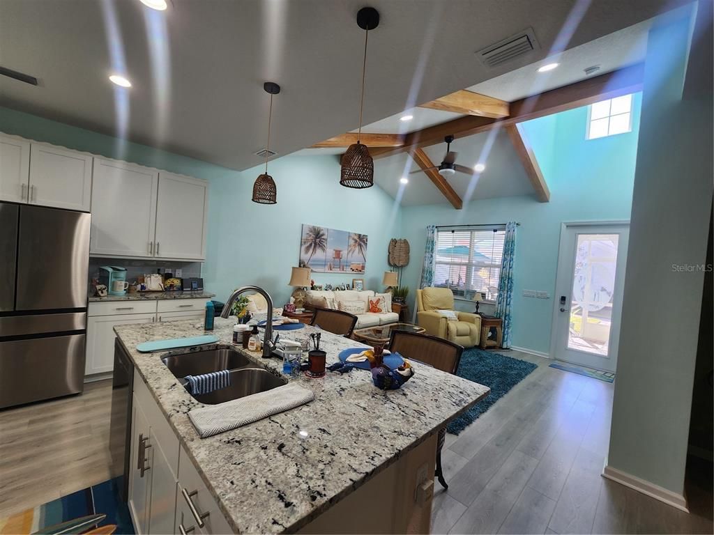 Interior, Kitchen, Living room, Pendant Lights, Recessed Lighting, Stainless Steel Appliances, Wooden Beams, Wood Texture Flooring