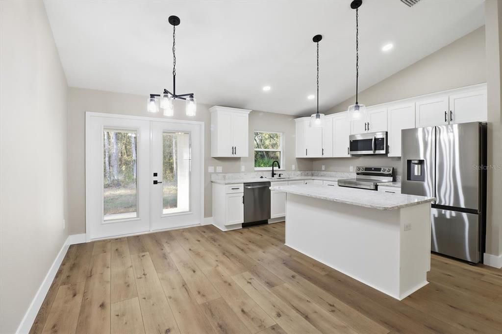 Interior, Kitchen, Pendant Lights, Recessed Lighting, Stainless Steel Appliances, Wood Texture Flooring