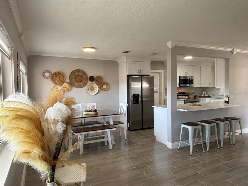 Dining room, Interior, Kitchen, Recessed Lighting, Stainless Steel Appliances, Wood Texture Flooring