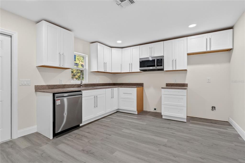 Interior, Kitchen, Recessed Lighting, Stainless Steel Appliances, Wood Texture Flooring