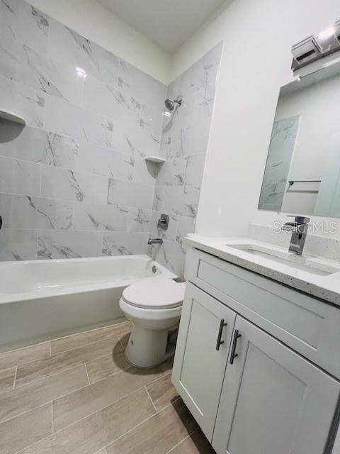 Bathroom, Dual Sink Vanities, Interior, Marble Walls, Wood Texture Flooring