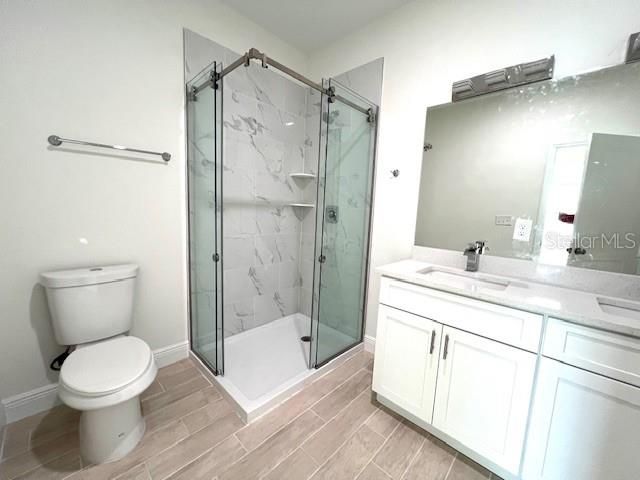 Bathroom, Glass Shower, Interior, Marble Walls, Wood Texture Flooring