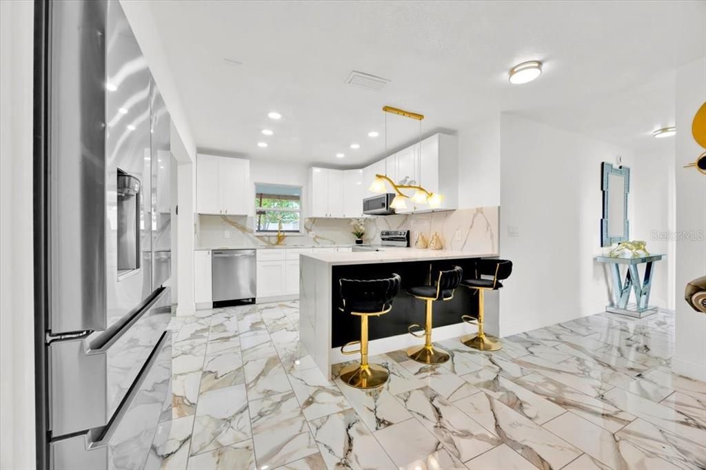 Interior, Kitchen, Marble, Marble Walls, Recessed Lighting, Stainless Steel Appliances