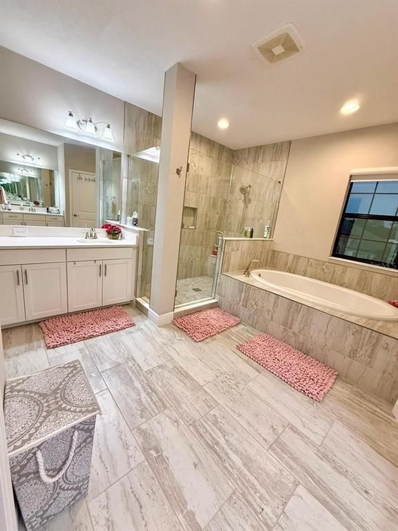 Bathroom, Dual Sink Vanities, Glass Shower, Interior, Marble, Recessed Lighting, Wood Texture Flooring