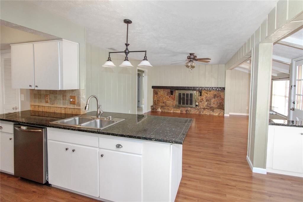 Fireplace, Interior, Kitchen, Pendant Lights, Stone Walls, Wood Texture Flooring