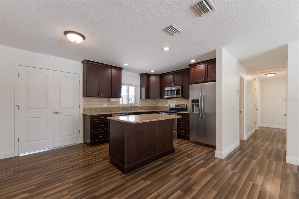 Interior, Kitchen, Recessed Lighting, Stainless Steel Appliances, Wood Texture Flooring