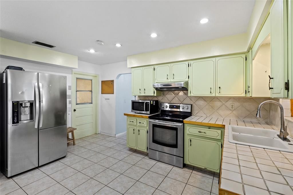 Interior, Kitchen, Recessed Lighting, Stainless Steel Appliances, Tile Countertops