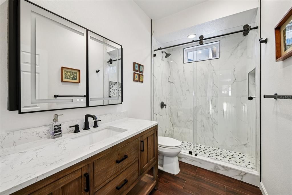 Bathroom, Glass Shower, Interior, Marble Walls, Wood Texture Flooring