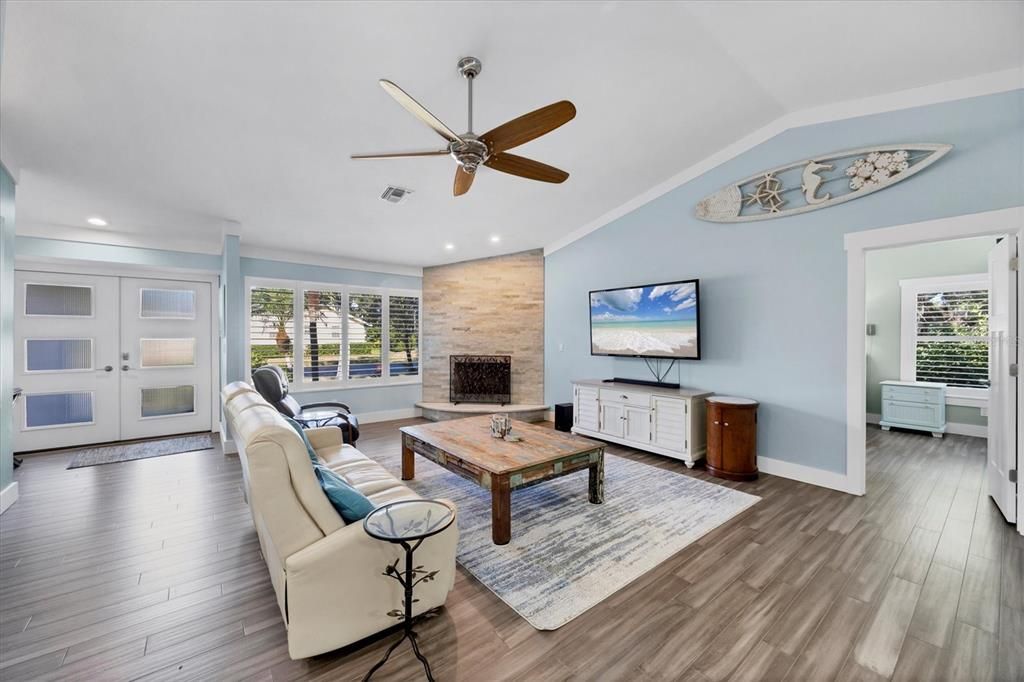 Fireplace, Interior, Living room, Recessed Lighting, Stone Walls, Wood Texture Flooring