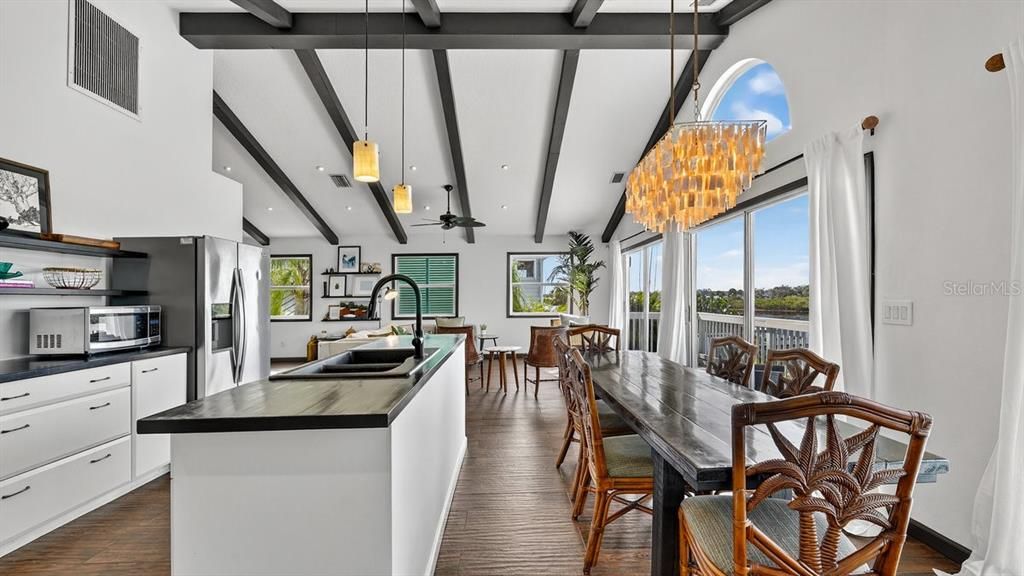 Chandelier, Dining room, Interior, Kitchen, Pendant Lights, Recessed Lighting, Stainless Steel Appliances, Wooden Beams, Wood Texture Flooring