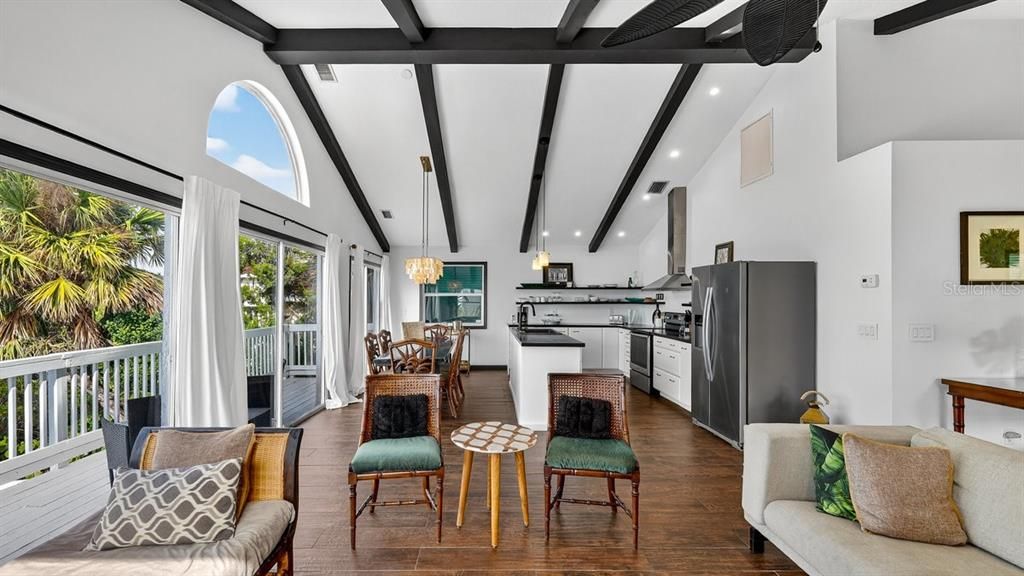 Chandelier, Dining room, Interior, Kitchen, Pendant Lights, Recessed Lighting, Stainless Steel Appliances, Wooden Beams, Wood Texture Flooring