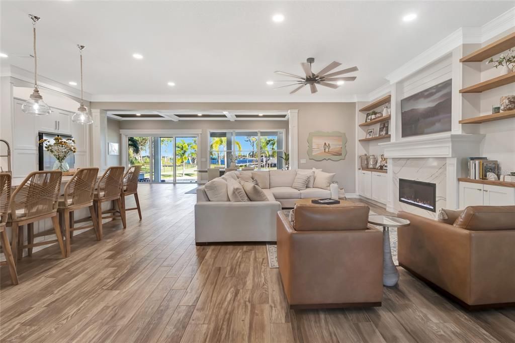 Dining room, Fireplace, Interior, Living room, Pendant Lights, Recessed Lighting, Wood Texture Flooring