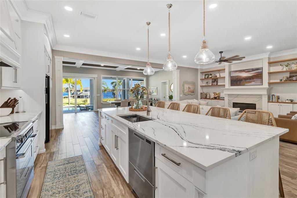 Dining room, Fireplace, Interior, Kitchen, Living room, Pendant Lights, Recessed Lighting, Stainless Steel Appliances, Wood Texture Flooring