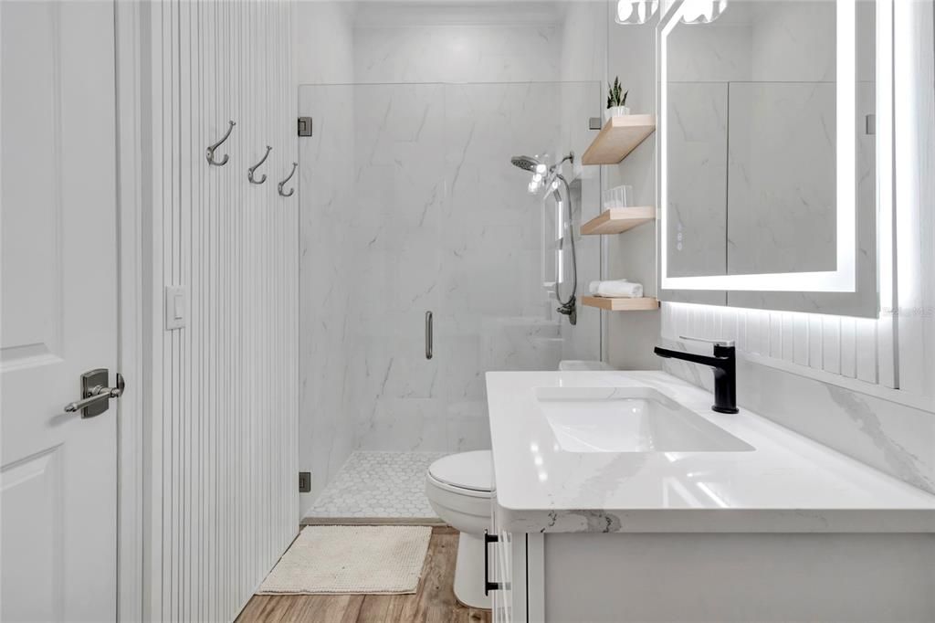 Bathroom, Glass Shower, Interior, Marble Walls, Wood Texture Flooring