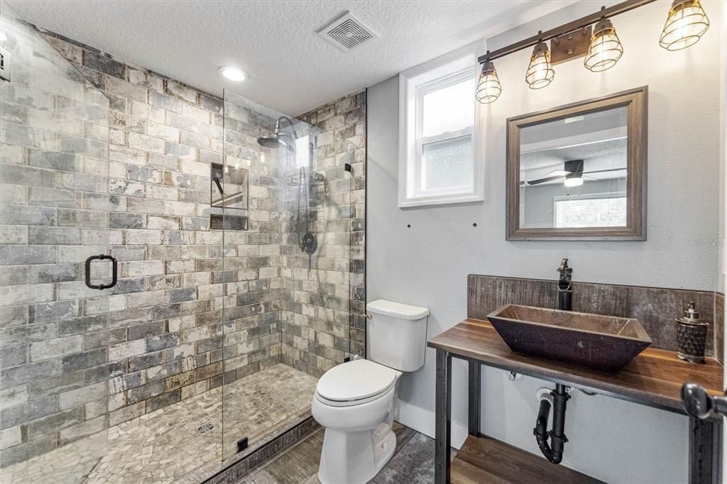 Bathroom, Glass Shower, Interior, Recessed Lighting, Stone Walls