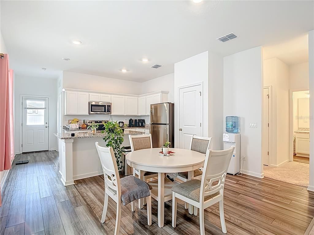 Dining room, Interior, Kitchen, Recessed Lighting, Stainless Steel Appliances, Wood Texture Flooring
