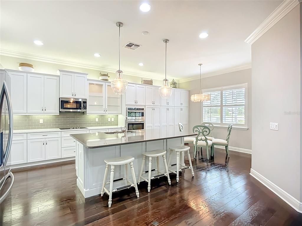 Dining room, Interior, Kitchen, Pendant Lights, Recessed Lighting, Stainless Steel Appliances, Wood Texture Flooring