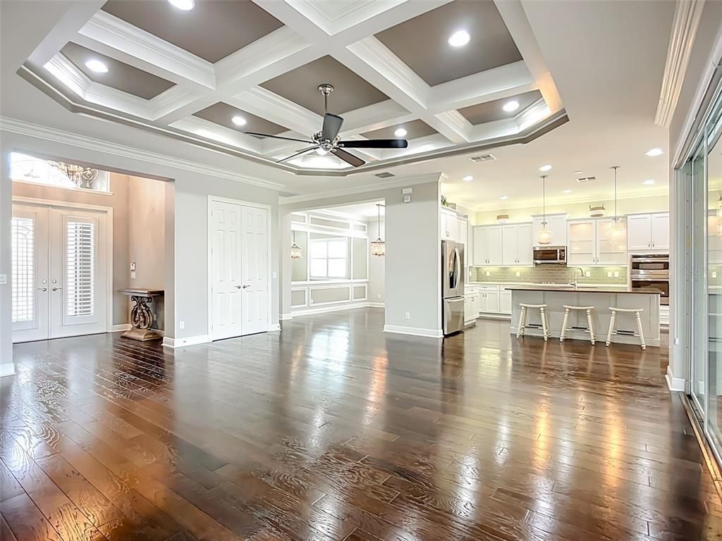 Empty room, Interior, Kitchen, Pendant Lights, Recessed Lighting, Stainless Steel Appliances, Wood Texture Flooring