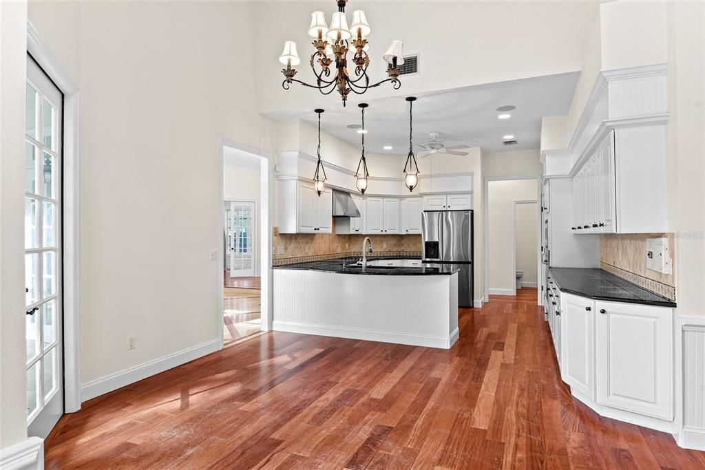 Chandelier, Interior, Kitchen, Pendant Lights, Recessed Lighting, Stainless Steel Appliances, Wood Texture Flooring