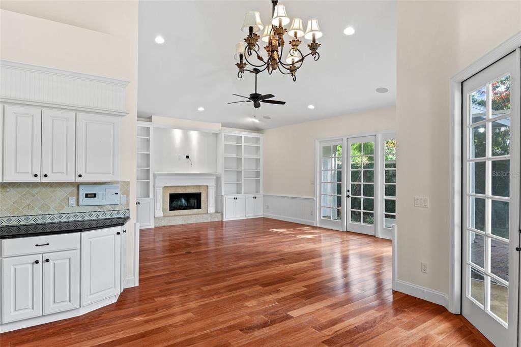 Chandelier, Empty room, Fireplace, Interior, Recessed Lighting, Wood Texture Flooring